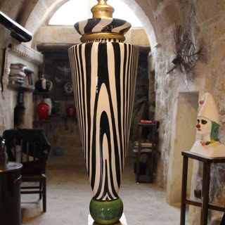 Large zebra urn in cave workshop